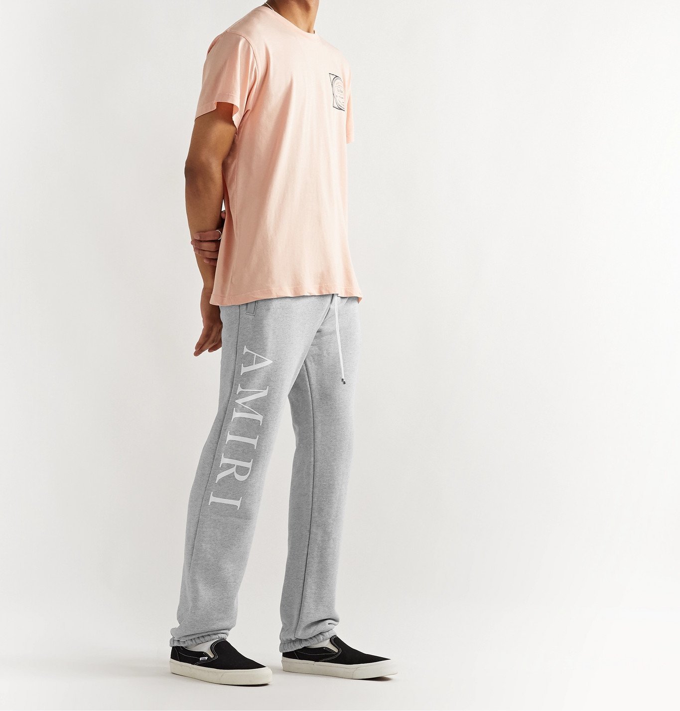 AMIRI - Tapered Logo-Print Mélange Loopback Cotton-Jersey Sweatpants