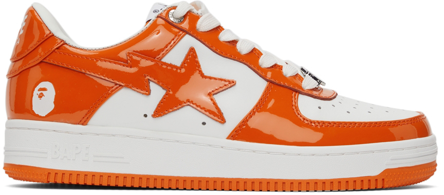 Photo: BAPE White & Orange STA Low Sneakers