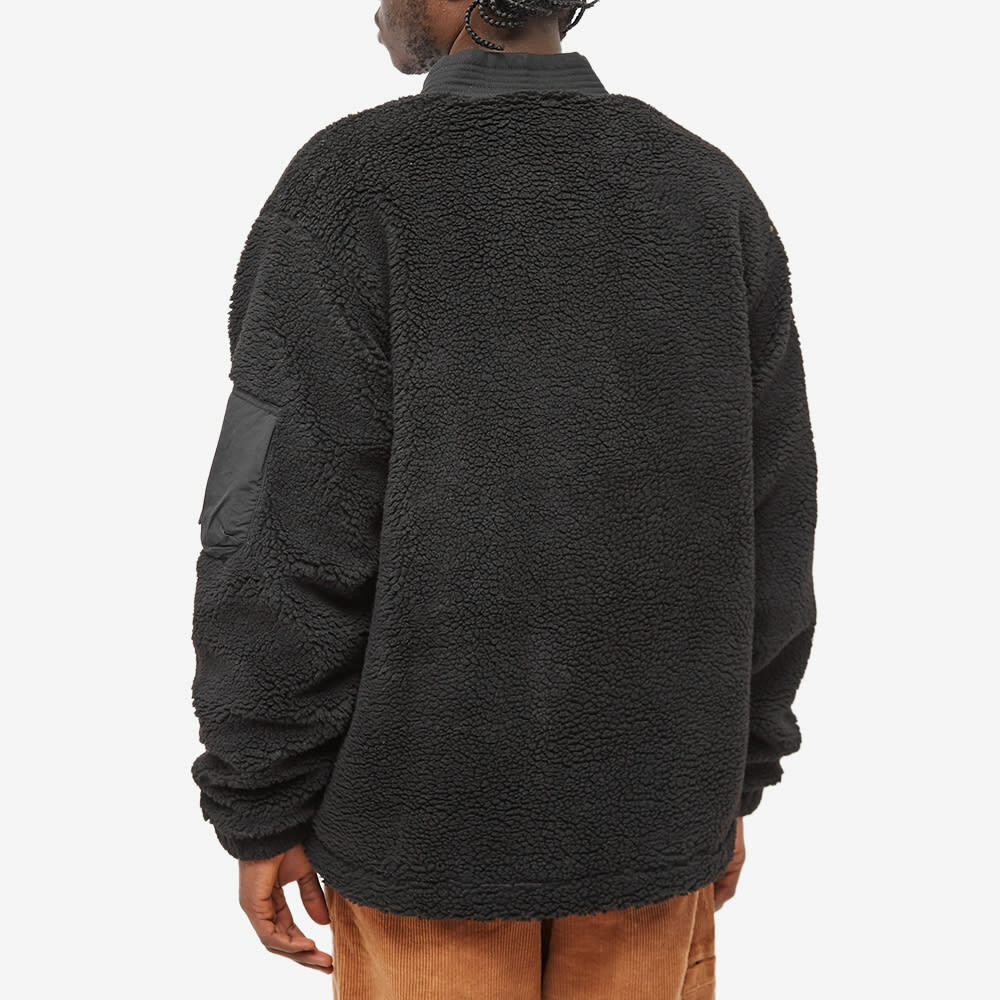 green jumper black jeans