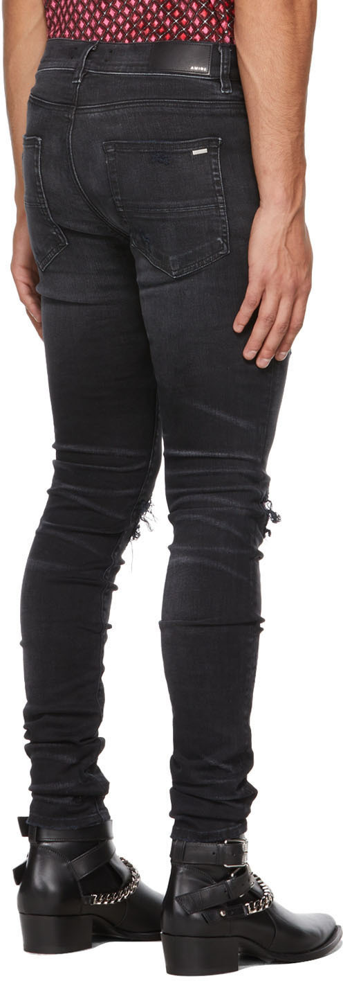 black and pink amiri jeans