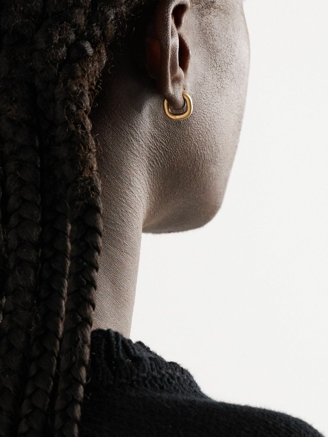 Photo: Shola Branson - Cushion Huggie 18-Karat Gold Hoop Earrings