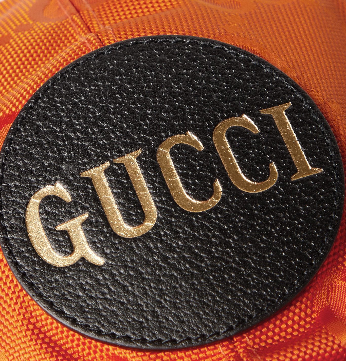 orange gucci logo