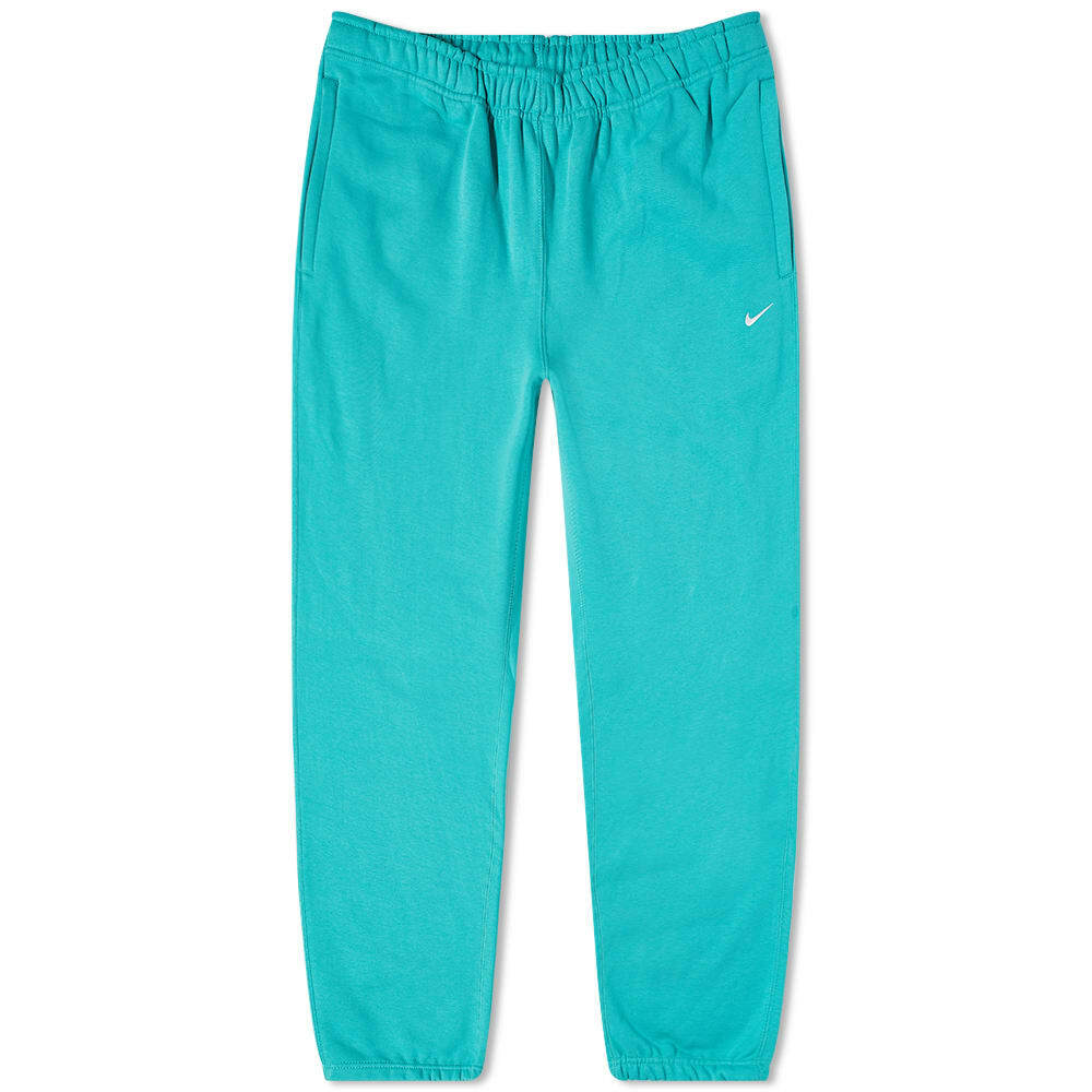 white nike shoes with teal swoosh