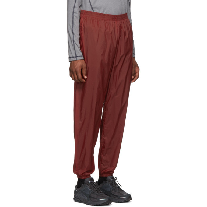 red nylon track pants